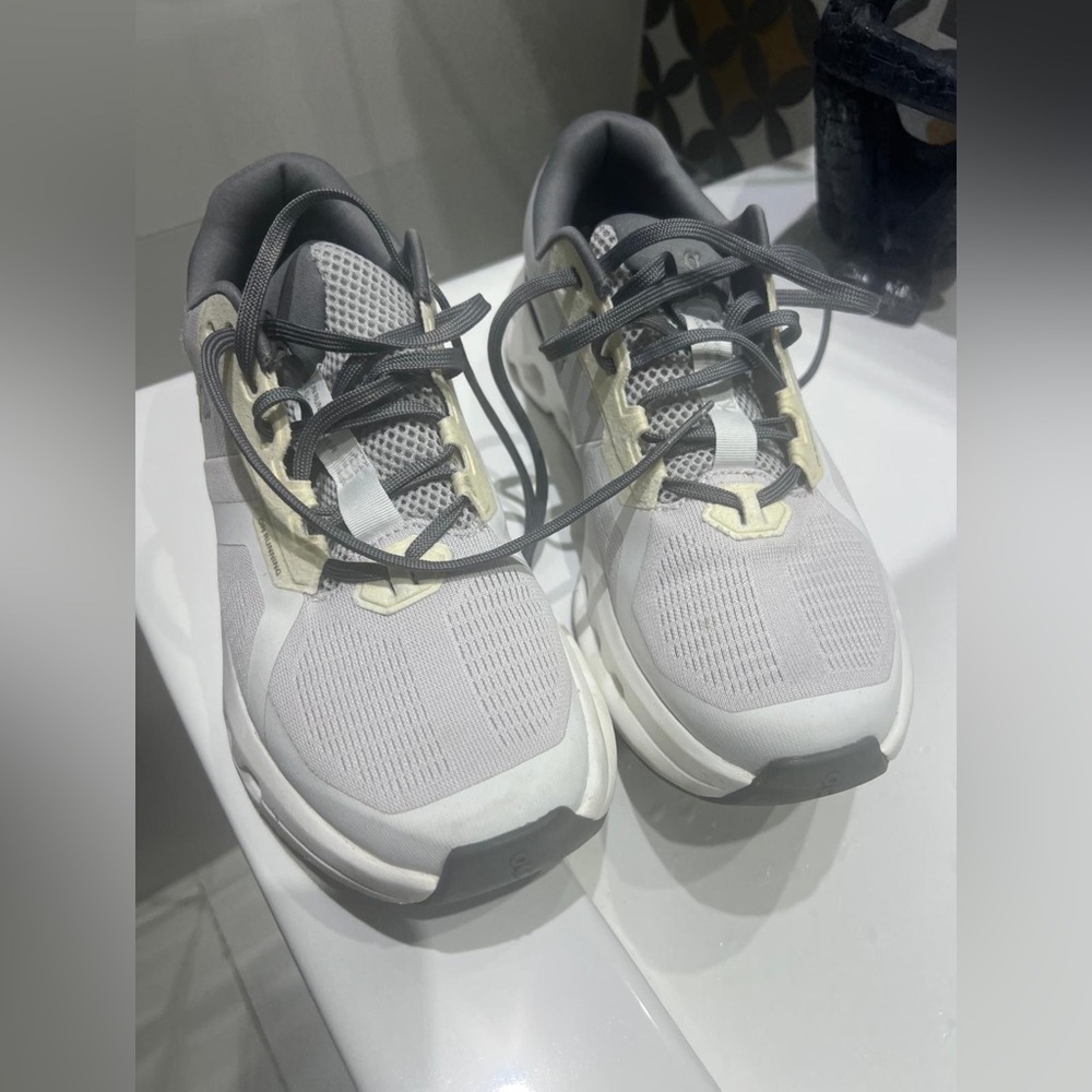On Running Gray and White Sneakers On Cloud